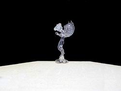 hand blown glass Angel figurine with wings and is praying with head down