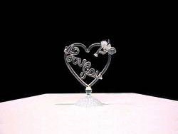 handblown glass heart with a solid glass Angel and the words I love you inside.