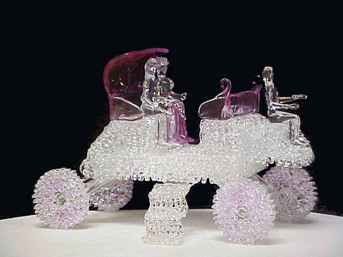 Horse-Drawn Carriage wedding cake top with bride and groom.