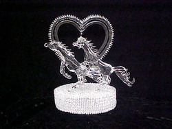 handblown glass horse wedding cake top with a solid glass heart.