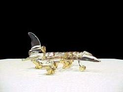 solid glass jet airplane with lots of gold