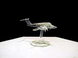 solid glass twin-engine airplane with a solid glass stand