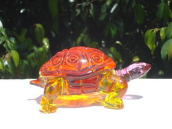 this is a picture of a solid glass turtle figurine.