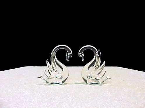 Swan wedding cake top glass swan figurines.
