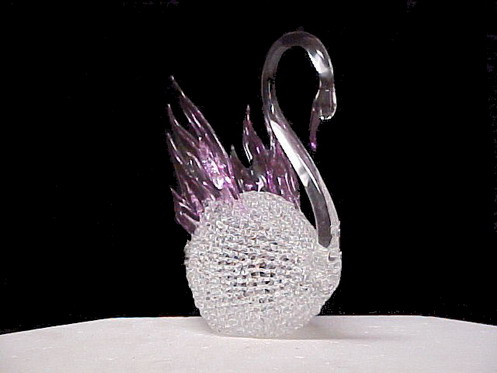 Swan wedding cake top a combination of new knitted and solid hand blown glass.