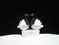 Swan wedding cake top with two swans kissing
